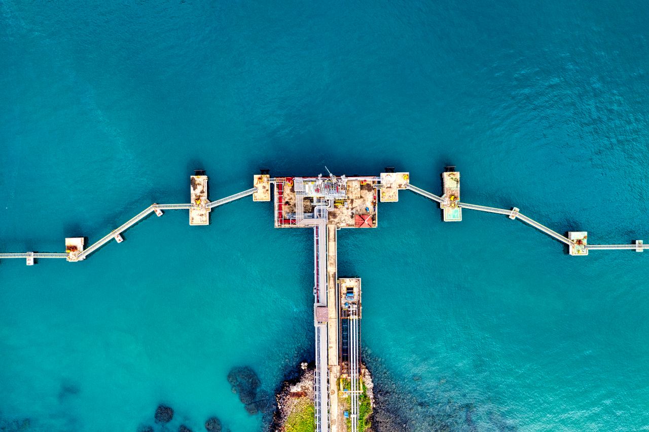 The Art of Drawing Readers In: Your attractive post title goes here Aerial photograph of a uniquely structured pier extending into the sea in Banten, Indonesia.