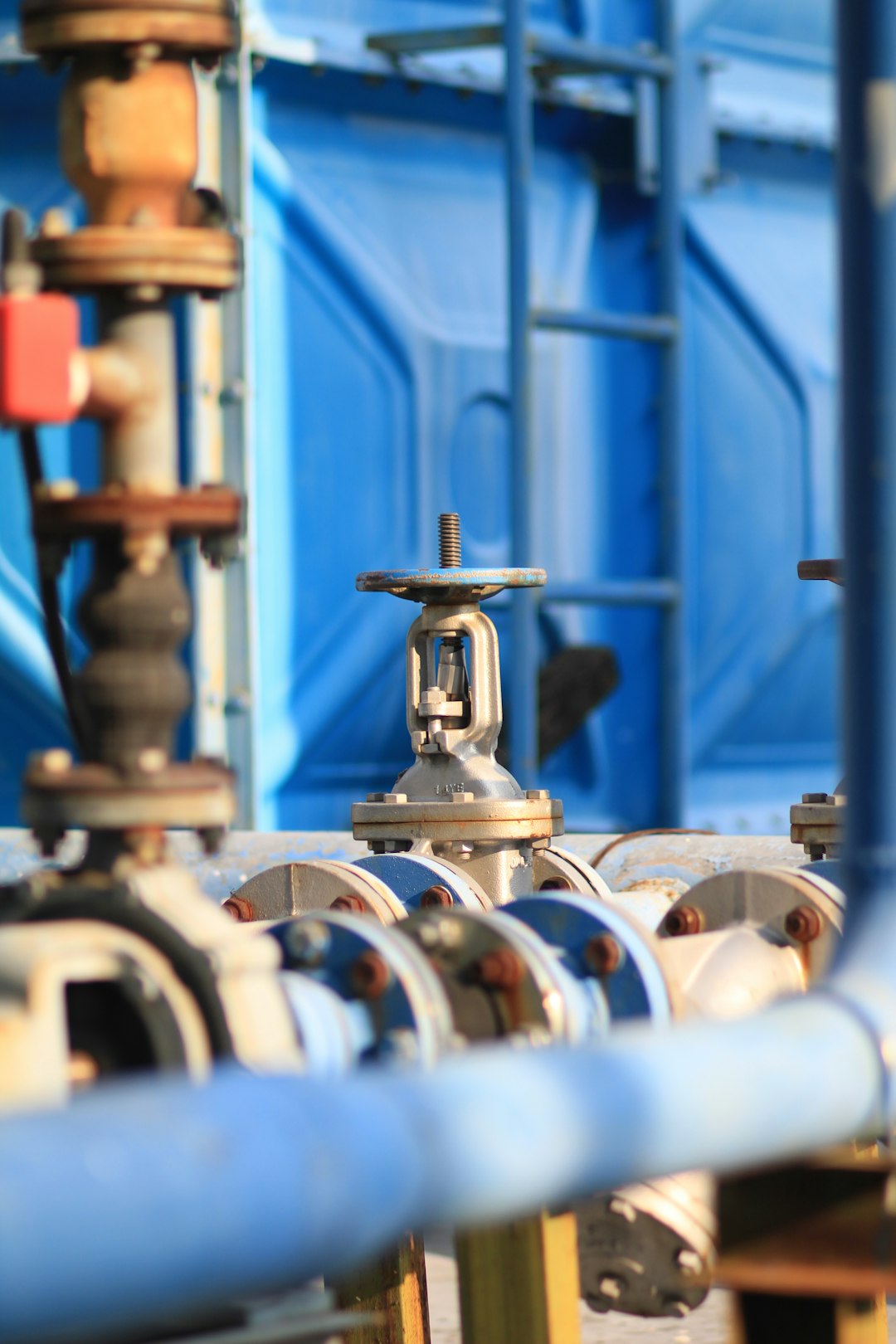 hero pipes-and-valves-are-lined-up-in-a-factory-gyrkbmeh1tc